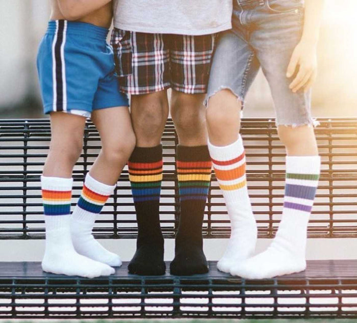 Close-up of Brave rainbow kids tube socks with brothers matching