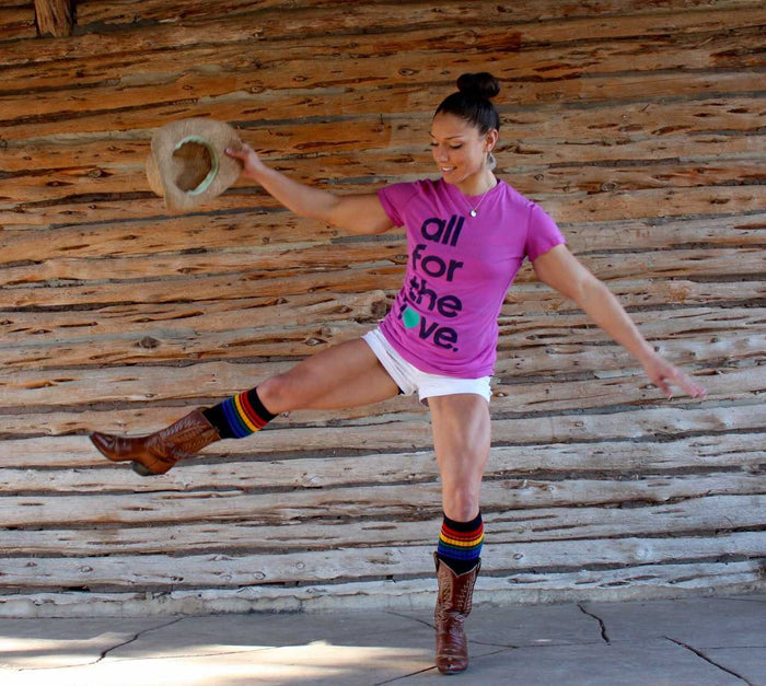 Lifestyle image of Brave rainbow knee high tube socks outdoors