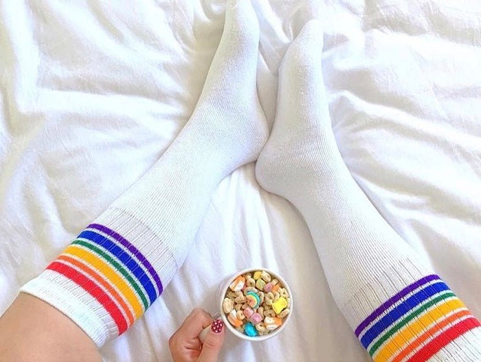 Close-up of Fearless rainbow knee high tube socks by Pride Socks